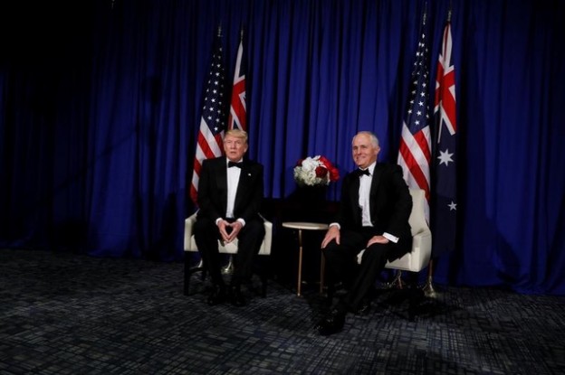 U.S. President Donald Trump (L) and Australia's Prime Minister Malcolm Turnbull (R) deliver brief remarks to reporters as they meet ahead of an event commemorating the 75th anniversary of the Battle of the Coral Sea, aboard the USS Intrepid Sea, Air and Space Museum in New York, U.S. May 4, 2017. REUTERS/Jonathan Ernst - RTS158D6