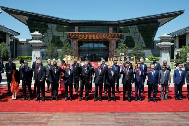 Leaders attending the Belt and Road Forum wave as they pose for a group photo at the Yanqi Lake venue on the outskirt of Beijing, China, May 15, 2017. REUTERS/Ng Han Guan/Pool - RC1E569ABA50