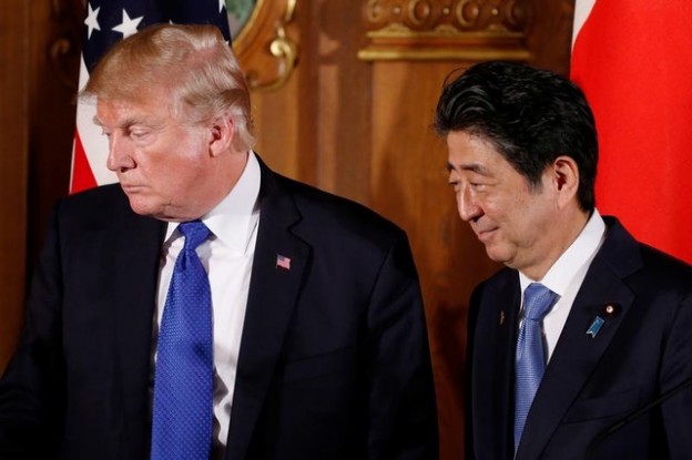 U.S. President Donald Trump and Japan's Prime Minister Shinzo Abe depart at the end of a news conference at Akasaka Palace in Tokyo, Japan, November 6, 2017. REUTERS/Jonathan Ernst - RC1D6FF95B30