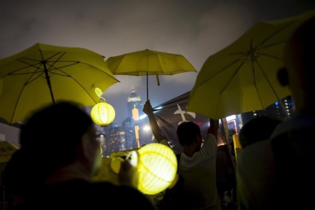 Pro-democracy protesters rise their yellow umbrellas, the symbol of the Occupy Central movement, as they march to the government headquarters two days before the first anniversary of the Occupy Central civil disobedience movement, in Hong Kong, China September 26, 2015. REUTERS/Tyrone Siu       TPX IMAGES OF THE DAY      - GF10000221829