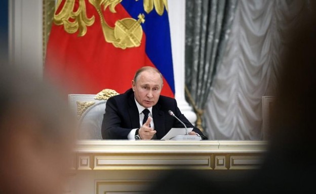 Russia's President Vladimir Putin attends a meeting with officials and representatives of Russian business community at the Kremlin in Moscow, Russia December 26, 2018. Alexander Nemenov/Pool via REUTERS - RC171299C650