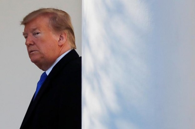 U.S. President Donald Trump heads back to the Oval Office after declaring a national emergency at the U.S.-Mexico border during remarks about border security in the Rose Garden of the White House in Washington, U.S., February 15, 2019. REUTERS/Carlos Barria - RC17F0AE0D30
