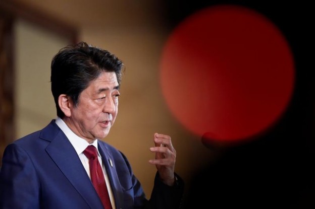 Japan's Prime Minister Shinzo Abe answers questions at a news conference at the 8th trilateral leaders' meeting between China, South Korea and Japan in Chengdu, Sichuan province, China December 24, 2019. Wang Zhao/Pool via REUTERS - RC2M1E9UISKD