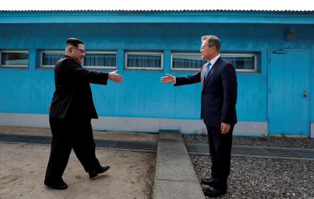 South Korean President Moon Jae-in and North Korean leader Kim Jong Un shake hands at the truce village of Panmunjom inside the demilitarized zone separating the two Koreas, South Korea, April 27, 2018.   Korea Summit Press Pool/Pool via Reuters     TPX IMAGES OF THE DAY - RC1BC18094E0