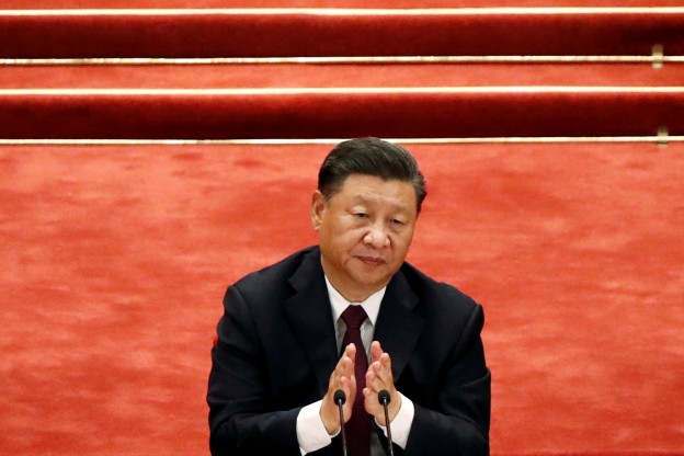 Chinese President Xi Jinping applauds during a meeting to commend role models in China's fight against the coronavirus disease (COVID-19) outbreak, at the Great Hall of the People in Beijing, China September 8, 2020. REUTERS/Carlos Garcia Rawlins - RC23UI9XUC48