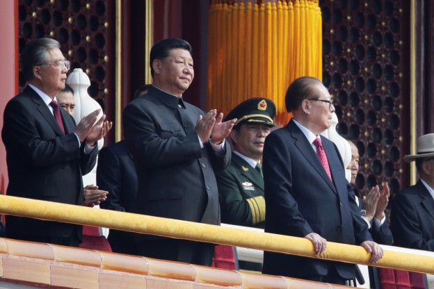 Chinese President Xi Jinping applauds as he stands between former presidents Hu Jintao and Jiang Zemin on Tiananmen Gate before the military parade marking the 70th founding anniversary of People's Republic of China, on its National Day in Beijing, China October 1, 2019. REUTERS/Jason Lee - SP1EFA1063B09